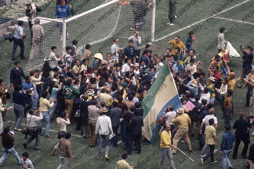 21 June 1970 - FIFA World Cup Final - Brazil v Italy - Pele of Brazil is lifted up by the fans invading the pitch after the full time whistle. 
