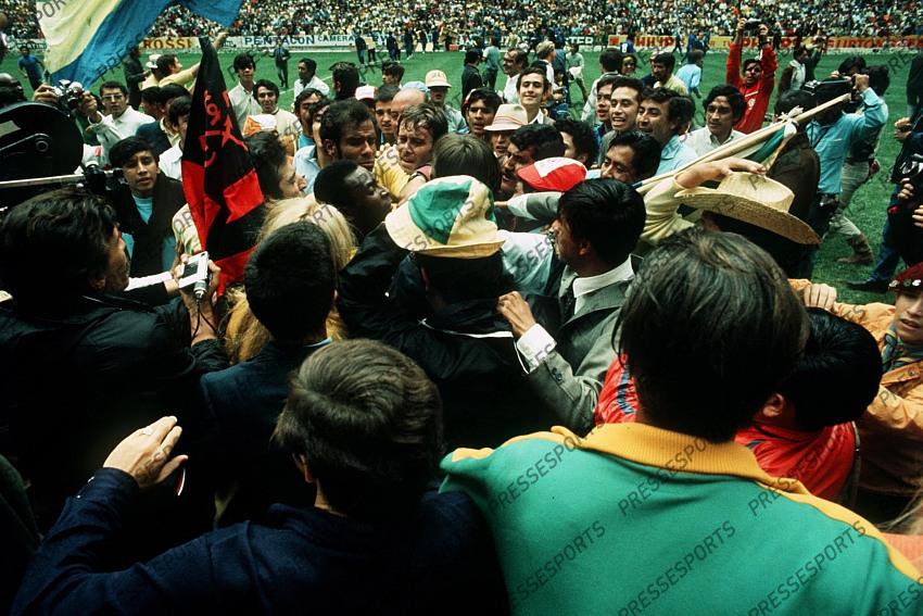 World Cup final 1970 at the Aztec Stadium in Mexico City. Brazil 4 v Italy 1. Brazilian forward Pele is mobbed by jubilant fans as Brazil win the World Cup for the third time. 21st June 1970. 