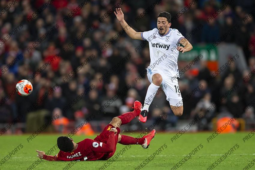 24 February 2020, Liverpool - Premier League Football - Liverpool v West Ham United. Pablo Fornals of West Ham United is tackled by Joe Gomez of Liverpool (photo by Daniel Chesterton) 