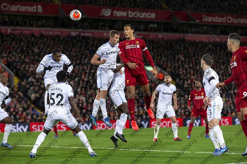 24 February 2020, Liverpool - Premier League Football - Liverpool v West Ham United. Virgil van Dijk of Liverpool heads the ball at goal (photo by Daniel Chesterton) 