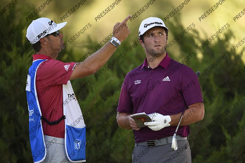 Oct 15, 2020; Las Vegas, Nevada, USA; Jon Rahm speaks wit his caddie Adam Hayes on the fifth hole during the first round of the CJ Cup golf tournament at Shadow Creek Golf Course. Mandatory Credit: Kelvin Kuo-USA TODAY Sports 