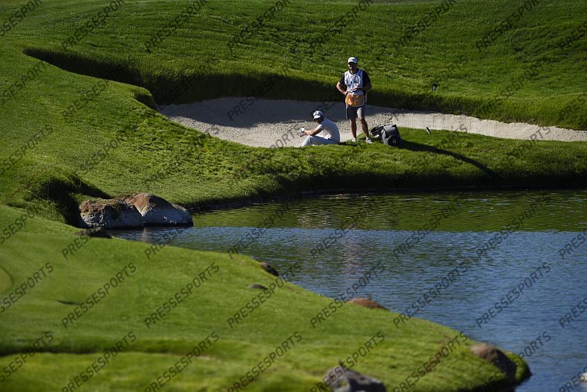 Oct 15, 2020; Las Vegas, Nevada, USA; Matthew Wolff sits in a bunker on the fourth hole during the first round of the CJ Cup golf tournament at Shadow Creek Golf Course. Mandatory Credit: Kelvin Kuo-USA TODAY Sports 