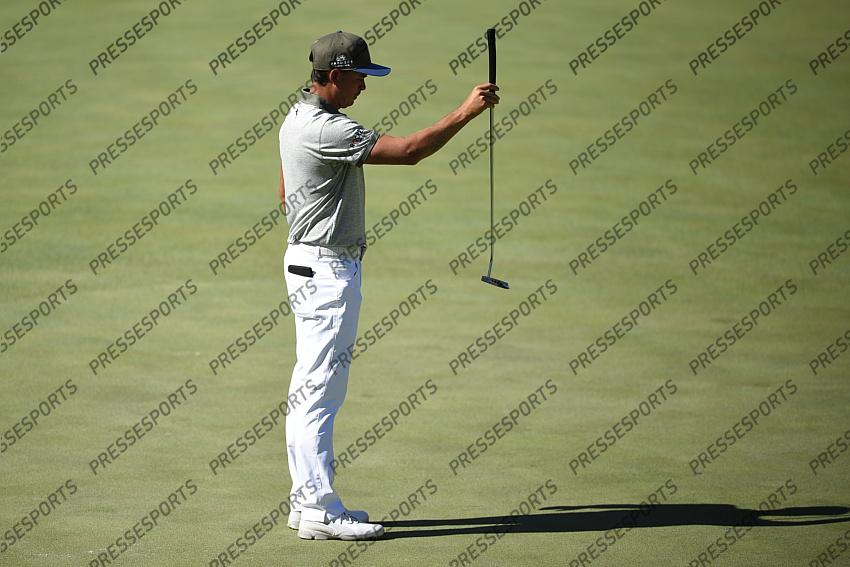 Oct 15, 2020; Las Vegas, Nevada, USA; Rickie Fowler lines up his putt on the fourth hole during the first round of the CJ Cup golf tournament at Shadow Creek Golf Course. Mandatory Credit: Kelvin Kuo-USA TODAY Sports 