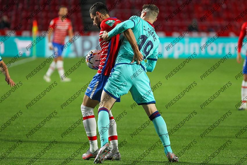 Carlos Clerc of Levante UD and Enis Bardhi of Levante UD fight for the ball during the La Liga football match played between Granada CF and Levante UD at Nuevo los Carmenes stadium on November 01, 2020 in Granada, Spain. 
