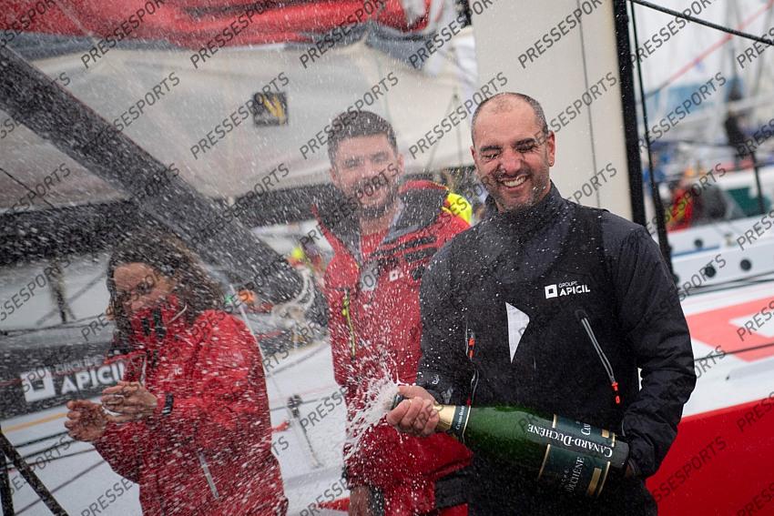 French skipper Damien Seguin (R) celebrates after crossing the finish line of the Vendee Globe round-the-world solo sailing race, at Les Sables d'Olonne, western France, on January 28, 2021. - Seguin, who sailed the Imoca 60 monohull "Groupe Apicil", finished in sixth position. (Photo by LOIC VENANCE / POOL / AFP) 