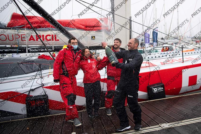 French skipper Damien Seguin (R) celebrates after crossing the finish line of the Vendee Globe round-the-world solo sailing race, at Les Sables d'Olonne, western France, on January 28, 2021. - Seguin, who sailed the Imoca 60 monohull "Groupe Apicil", finished in sixth position. (Photo by LOIC VENANCE / POOL / AFP) 