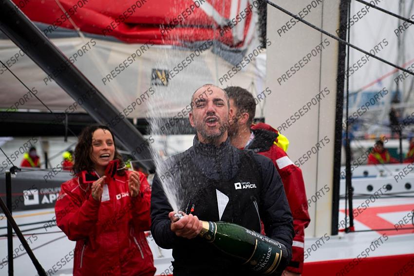 French skipper Damien Seguin (R) celebrates after crossing the finish line of the Vendee Globe round-the-world solo sailing race, at Les Sables d'Olonne, western France, on January 28, 2021. - Seguin, who sailed the Imoca 60 monohull "Groupe Apicil", finished in sixth position. (Photo by LOIC VENANCE / POOL / AFP) 