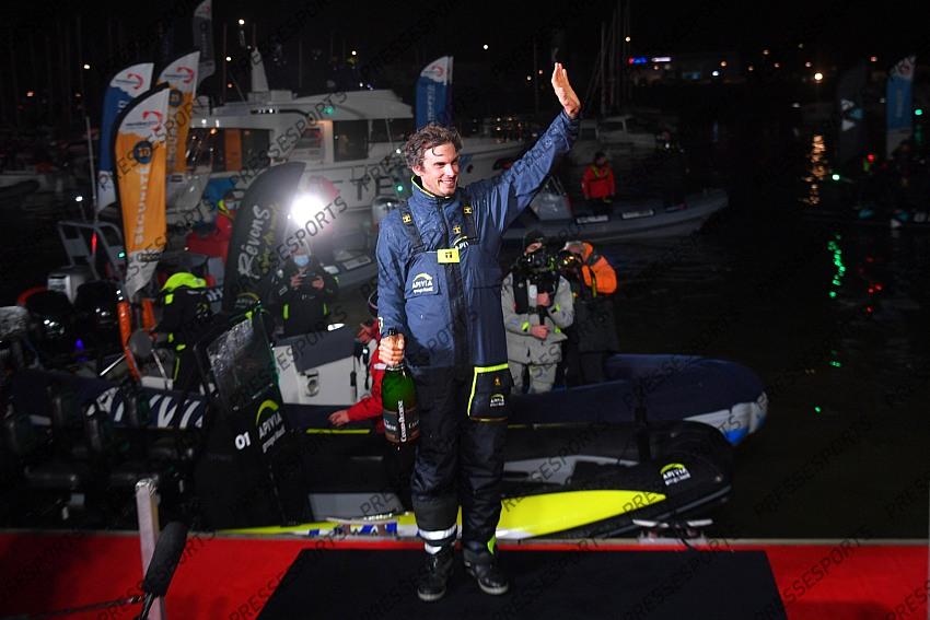 French skipper Charlie Dalin, 36, who sailed his Imoca 60 monohull 'Apivia' in the 2020/2021 ninth edition of the Vendee Globe round-the-world solo race, celebrates after crossing the finish line at Les Sables d'Olonne, western France, on January 27, 2021, - Dalin completed the epic race in 80 days, six hours, 15 minutes and 47 seconds. However, Germany's Boris Herrmann (SeaExplorer-Yacht Club de Monaco) and France's Yannick Bestaven (Maitre coq IV) are still in the running for the title. (Photo by LOIC VENANCE / POOL / AFP) 