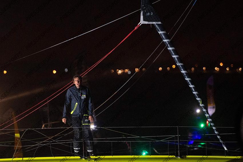 French skipper Charlie Dalin, 36, who sailed his Imoca 60 monohull 'Apivia' in the 2020/2021 ninth edition of the Vendee Globe round-the-world solo race, celebrates after crossing the finish line at Les Sables d'Olonne, western France, on January 27, 2021. - Dalin completed the epic race in 80 days, six hours, 15 minutes and 47 seconds. However, Germany's Boris Herrmann (SeaExplorer-Yacht Club de Monaco) and France's Yannick Bestaven (Maitre coq IV) are still in the running for the title. (Photo by LOIC VENANCE / POOL / AFP) 