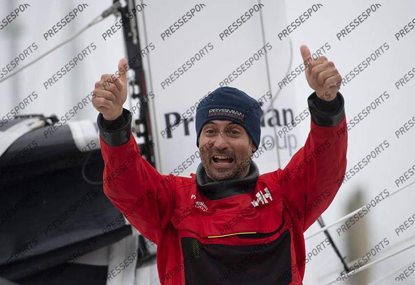 Italian skipper Giancarlo Pedote thumbs up after crossing the finish line of the Vendee Globe round-the-world solo sailing race, at Les Sables d'Olonne, western France, Thursday, Jan. 28, 2021. French sailor Yannick Bestaven won the Vendee Globe solo round-the-world race after more than 80 days and an unusually close final few hours to determine the winner on Thursday. (Loic Venance, Pool via AP) 