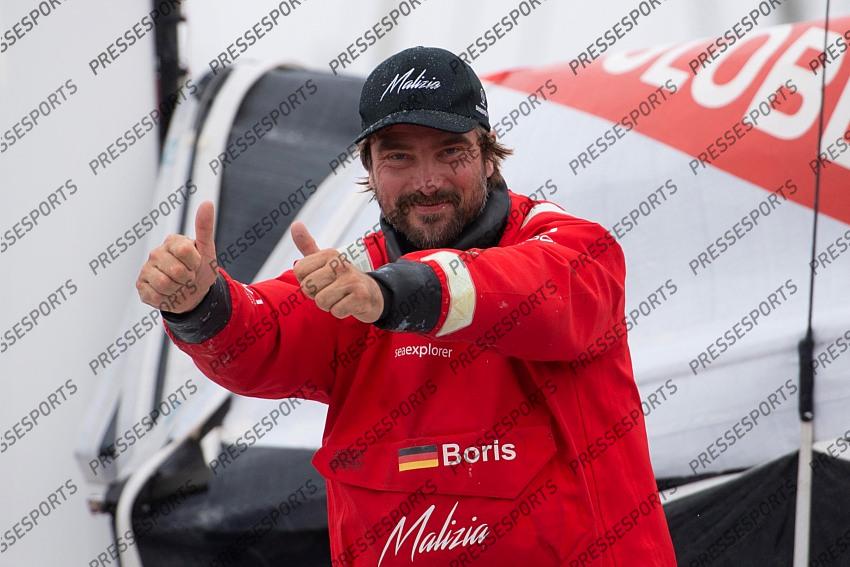 German skipper Boris Herrmann thumbs up after crossing the finish line of the Vendee Globe round-the-world solo sailing race, at Les Sables d'Olonne, western France, Thursday, Jan. 28, 2021. French sailor Yannick Bestaven won the Vendee Globe solo round-the-world race after more than 80 days and an unusually close final few hours to determine the winner on Thursday. (Loic Venance, Pool via AP) 