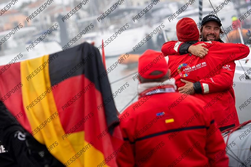German skipper Boris Herrmann , right, celebrates with relatives after crossing the finish line of the Vendee Globe round-the-world solo sailing race, at Les Sables d'Olonne, western France, Thursday, Jan. 28, 2021. French sailor Yannick Bestaven won the Vendee Globe solo round-the-world race after more than 80 days and an unusually close final few hours to determine the winner on Thursday. (Loic Venance, Pool via AP) 