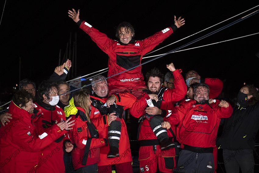 Frenchman Yannick Bestaven celebrates after winning the Vendee Globe solo round-the-world sailing race Thursday, Jan.28, 2021 in Les Sables-d'Olonne, western France. The 48-year-old Bestaven wasn't the first to cross the finish line ‚Äî that honor went to fellow Frenchman Charlie Dalin, who arrived in Les Sables-d'Olonne Wednesday night. (Loic Venance, Pool via AP) 