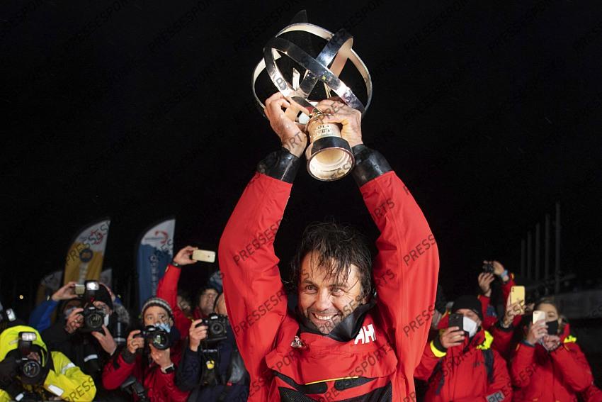 Frenchman Yannick Bestaven holds his trophy after winning the Vendee Globe solo round-the-world sailing race Thursday, Jan.28, 2021 in Les Sables-d'Olonne, western France. The 48-year-old Bestaven wasn't the first to cross the finish line ‚Äî that honor went to fellow Frenchman Charlie Dalin, who arrived in Les Sables-d'Olonne Wednesday night. (Loic Venance, Pool via AP) 