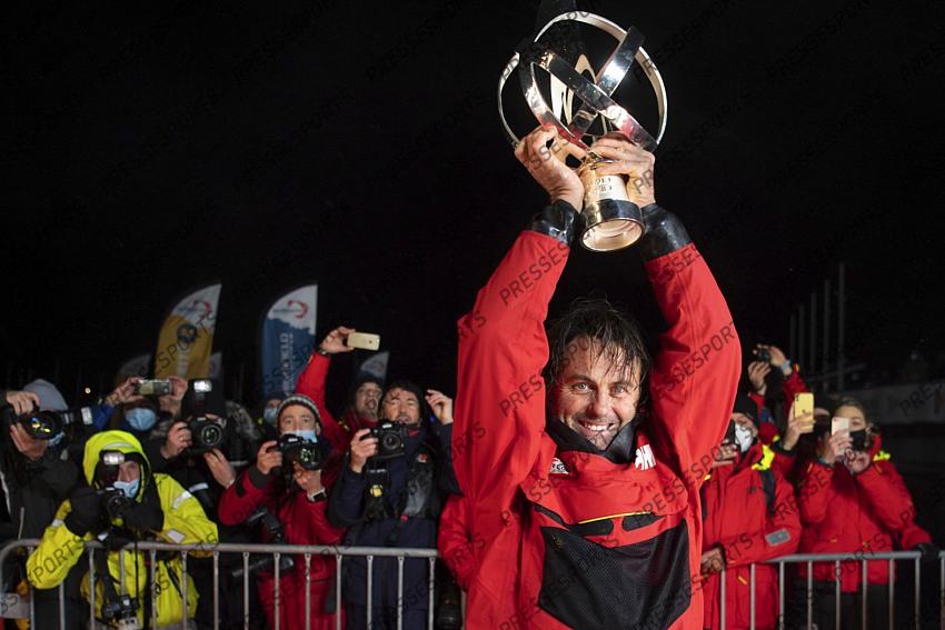 Frenchman Yannick Bestaven holds his trophy after winning the Vendee Globe solo round-the-world sailing race Thursday, Jan.28, 2021 in Les Sables-d'Olonne, western France. The 48-year-old Bestaven wasn't the first to cross the finish line ‚Äî that honor went to fellow Frenchman Charlie Dalin, who arrived in Les Sables-d'Olonne Wednesday night. (Loic Venance, Pool via AP) 