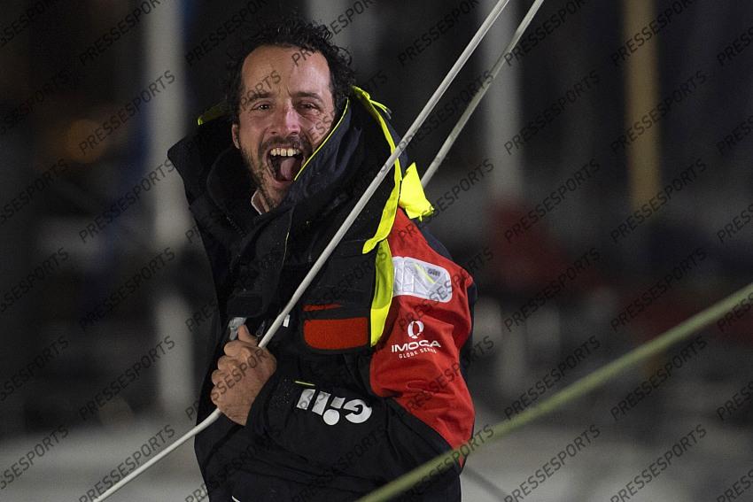French yachtman Louis Burton waves as he arrives in the port after placing third in the Vendee Globe solo around-the-world sailing race, in Les Sables-d'Olonne, western France, Thursday, Jan.28, 2021. (Loic Venance, Pool via AP) 