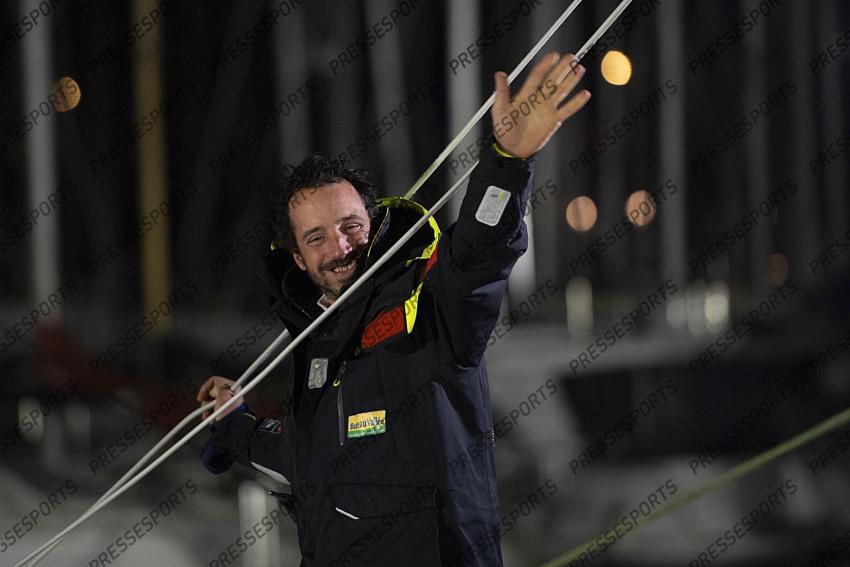 French yachtman Louis Burton waves as he arrives in the port after placing third in the Vendee Globe solo around-the-world sailing race, in Les Sables-d'Olonne, western France, Thursday, Jan.28, 2021. (Loic Venance, Pool via AP) 