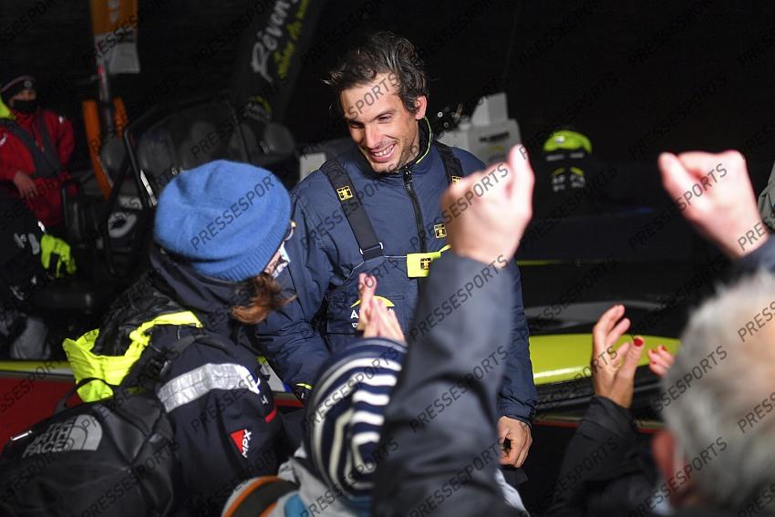 French yachtman Charlie Dalin celebrates with sister, left, mother, center, and father after crossing first the finish line of the Vendee Globe solo around-the-world sailing race, in Les Sables-d'Olonne, western France, Wednesday, Jan.27, 2021. The final winner of the race will be decided Thursday as some rival were given a time compensation. (Loic Venance, Pool via AP) 
