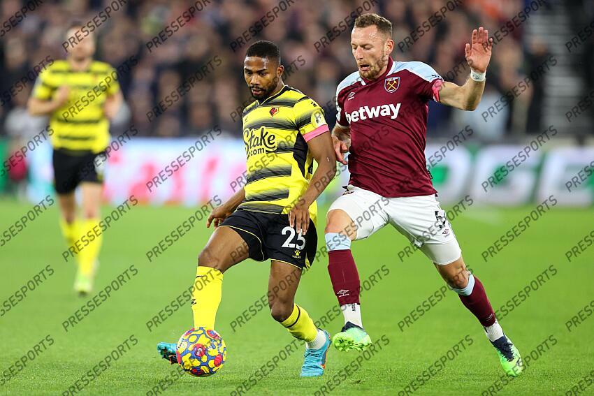 8 February 2022, London - Premier League Football - West Ham United v Watford - Emmanuel Dennis of Watford and Vladimir Coufal of West Ham - Photo: Charlotte Wilson / Offside. WEST HAM UNITED-WATFORD (1-0) 