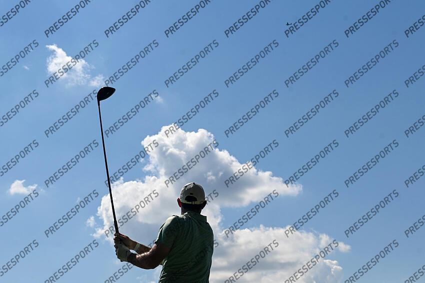 Aug 28, 2022; Atlanta, Georgia, USA; Rory McIlroy tees off on the 10th hole as a plane fly over during the final round of the TOUR Championship golf tournament. Mandatory Credit: Adam Hagy-USA TODAY Sports FINALE FEDEX CUP 