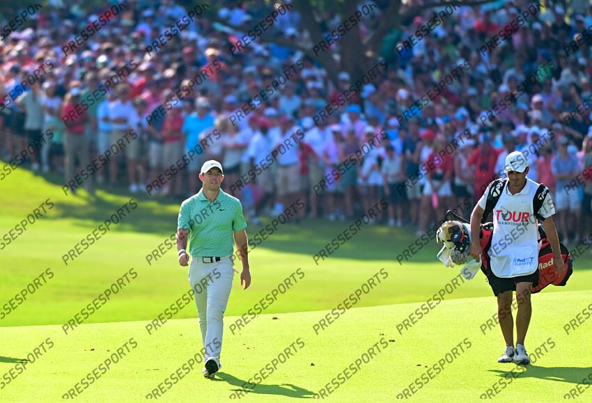Aug 28, 2022; Atlanta, Georgia, USA; Rory McIlroy walks to the 18th green with his caddie Harry Diamond during the final round of the TOUR Championship golf tournament. Mandatory Credit: Adam Hagy-USA TODAY Sports FINALE FEDEX CUP 