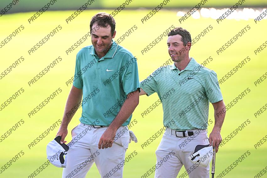 Aug 28, 2022; Atlanta, Georgia, USA; Scottie Scheffler and Rory McIlroy walk of the 18th green during the final round of the TOUR Championship golf tournament. Mandatory Credit: Adam Hagy-USA TODAY Sports FINALE FEDEX CUP 