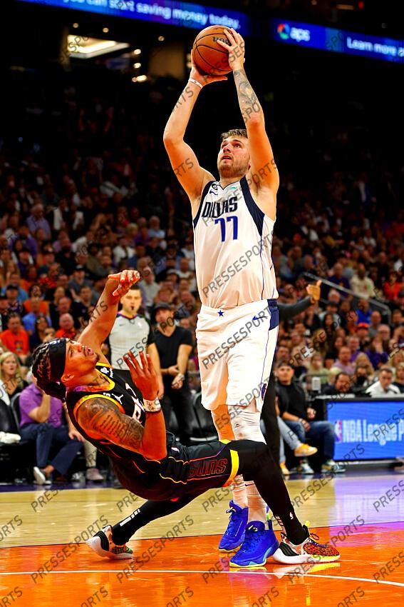 Oct 19, 2022; Phoenix, Arizona, USA; Dallas Mavericks guard Luka Doncic (77) shoots the ball against Phoenix Suns guard Damion Lee (10) during the fourth quarter at Footprint Center. Mandatory Credit: Mark J. Rebilas-USA TODAY Sports NBA: Dallas Mavericks at Phoenix Suns 
