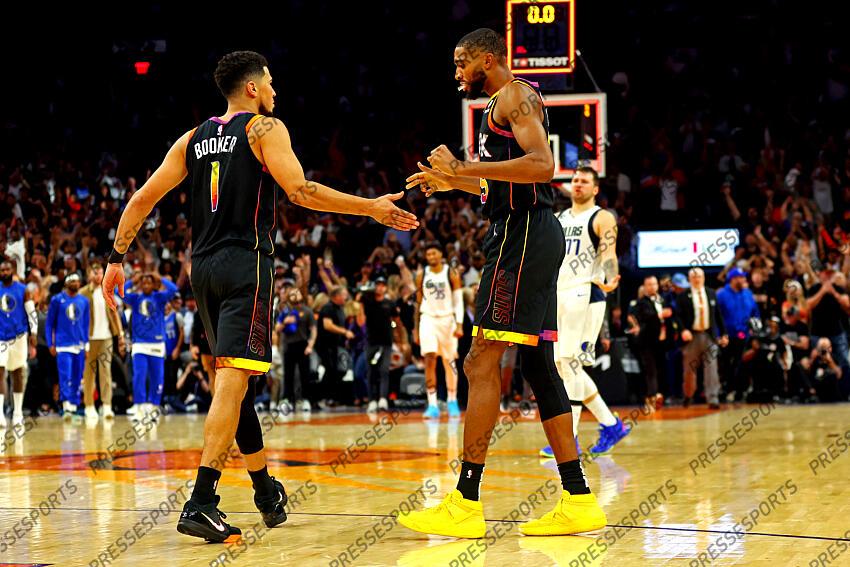 Oct 19, 2022; Phoenix, Arizona, USA; Phoenix Suns guard Devin Booker (1) celebrates with forward Mikal Bridges (25) after defeating the Dallas Mavericks at Footprint Center. Mandatory Credit: Mark J. Rebilas-USA TODAY Sports NBA: Dallas Mavericks at Phoenix Suns 