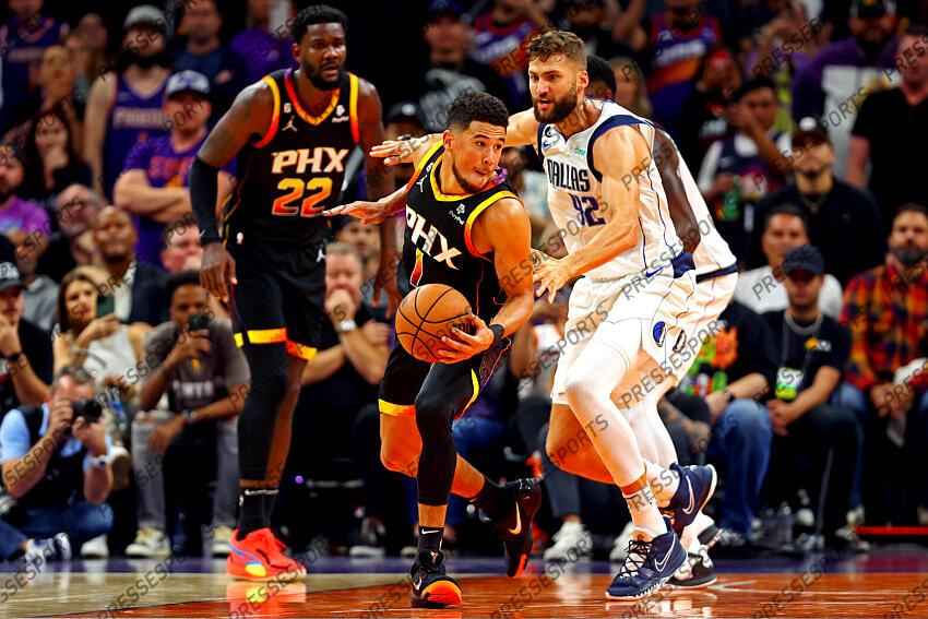 Oct 19, 2022; Phoenix, Arizona, USA; Phoenix Suns guard Devin Booker (1) handles the ball against Dallas Mavericks forward Maxi Kleber (42) during the fourth quarter at Footprint Center. Mandatory Credit: Mark J. Rebilas-USA TODAY Sports NBA: Dallas Mavericks at Phoenix Suns 