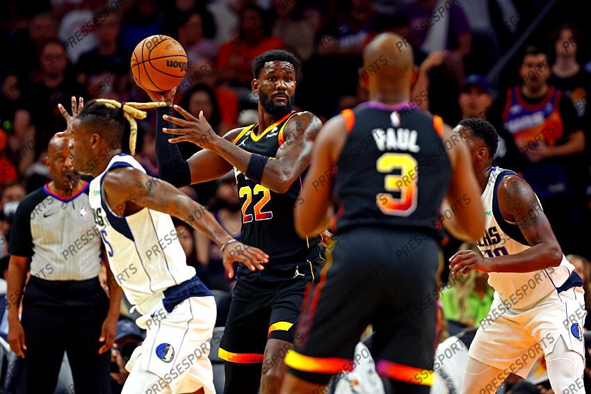 Oct 19, 2022; Phoenix, Arizona, USA; Phoenix Suns center Deandre Ayton (22) passes the ball to guard Chris Paul (3) against Dallas Mavericks forward Reggie Bullock (25) during the third quarter at Footprint Center. Mandatory Credit: Mark J. Rebilas-USA TODAY Sports NBA: Dallas Mavericks at Phoenix Suns 