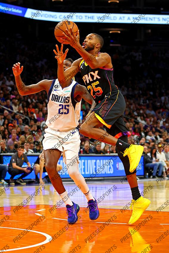 Oct 19, 2022; Phoenix, Arizona, USA; Phoenix Suns forward Mikal Bridges (25) shoots the ball against Dallas Mavericks forward Reggie Bullock (25) during the second quarter at Footprint Center. Mandatory Credit: Mark J. Rebilas-USA TODAY Sports NBA: Dallas Mavericks at Phoenix Suns 