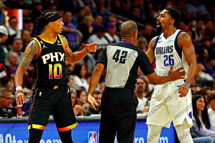 Oct 19, 2022; Phoenix, Arizona, USA; Phoenix Suns guard Damion Lee (10) and Dallas Mavericks guard Spencer Dinwiddie (26) are separated by referee Eric Lewis (42) during the second quarter at Footprint Center. Mandatory Credit: Mark J. Rebilas-USA TODAY Sports NBA: Dallas Mavericks at Phoenix Suns 