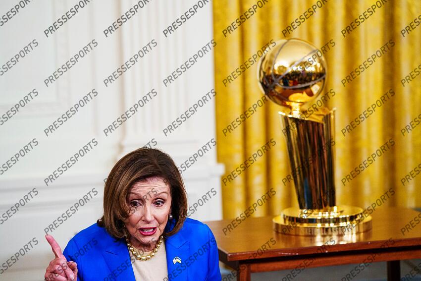 Jan 17, 2023; Washington, DC, USA; Rep. Nancy Pelosi stands next to the 2022 NBA championship trophy before a ceremony honoring the Golden State Warriors for their victory in the East Room of the White House. Mandatory Credit: Josh Morgan-USA TODAY GOLDEN STATE WARRIORS A LA MAISON BLANCHE 
