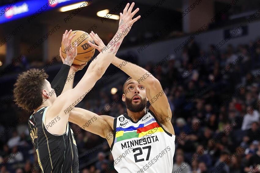 Feb 24, 2023; Minneapolis, Minnesota, USA; Minnesota Timberwolves center Rudy Gobert (27) goes to the basket as Charlotte Hornets guard LaMelo Ball (1) defends him in the third quarter at Target Center. Mandatory Credit: Bruce Kluckhohn-USA TODAY Sports NBA: Charlotte Hornets at Minnesota Timberwolves 