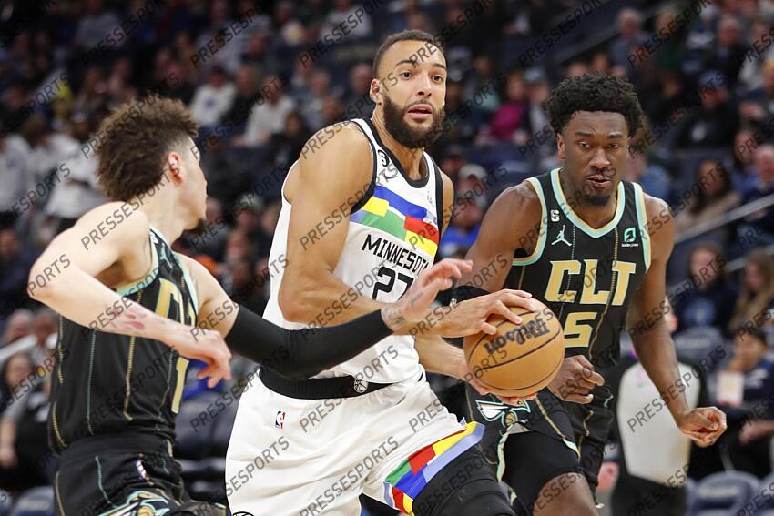 Feb 24, 2023; Minneapolis, Minnesota, USA; Minnesota Timberwolves center Rudy Gobert (27) goes to the basket between Charlotte Hornets guard LaMelo Ball (1) and center Mark Williams (5) in the third quarter at Target Center. Mandatory Credit: Bruce Kluckhohn-USA TODAY Sports NBA: Charlotte Hornets at Minnesota Timberwolves 