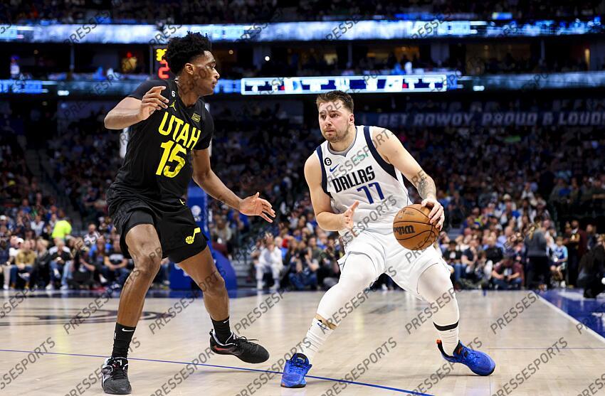 Mar 7, 2023; Dallas, Texas, USA; Dallas Mavericks guard Luka Doncic (77) looks to shoot as Utah Jazz center Damian Jones (15) defends during the second half at American Airlines Center. Mandatory Credit: Kevin Jairaj-USA TODAY Sports NBA: Utah Jazz at Dallas Mavericks 