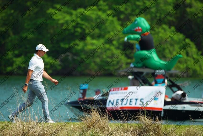 Mar 26, 2023; Austin, Texas, USA; Rory McIlroy walks the fourteenth fairway past a Netjets advertisement in a match against Cameron Young during the final day of the World Golf Championships-Dell Technologies Match Play golf tournament. Mandatory Credit: Dustin Safranek-USA TODAY Sports PGA: World Golf Championships-Dell Technologies Match Play - Final Round 