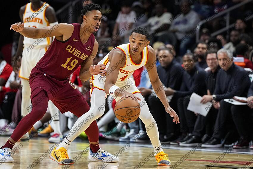 Oct 10, 2023; Atlanta, Georgia, USA; Atlanta Hawks guard Kobe Bufkin (4) and Cleveland Cavaliers guard Zhaire Smith (19) fight for the ball during the second half at State Farm Arena. Mandatory Credit: Dale Zanine-USA TODAY Sports NBA: Preseason-Cleveland Cavaliers at Atlanta Hawks 