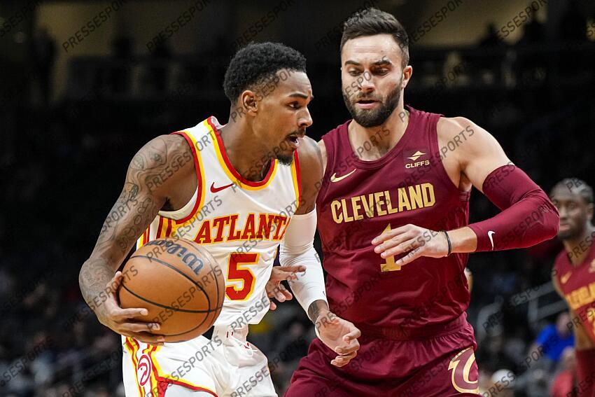 Oct 10, 2023; Atlanta, Georgia, USA; Atlanta Hawks guard Dejounte Murray (5) dribbles against Cleveland Cavaliers guard Max Strus (1) during the first half at State Farm Arena. Mandatory Credit: Dale Zanine-USA TODAY Sports NBA: Preseason-Cleveland Cavaliers at Atlanta Hawks 
