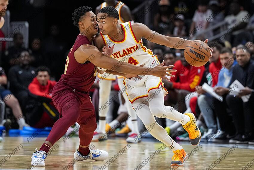 Oct 10, 2023; Atlanta, Georgia, USA; Atlanta Hawks guard Kobe Bufkin (4) and Cleveland Cavaliers guard Zhaire Smith (19) fight for the ball during the second half at State Farm Arena. Mandatory Credit: Dale Zanine-USA TODAY Sports NBA: Preseason-Cleveland Cavaliers at Atlanta Hawks 