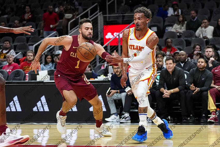 Oct 10, 2023; Atlanta, Georgia, USA; Atlanta Hawks guard Trae Young (11) passes the ball past Cleveland Cavaliers guard Max Strus (1) during the first half at State Farm Arena. Mandatory Credit: Dale Zanine-USA TODAY Sports NBA: Preseason-Cleveland Cavaliers at Atlanta Hawks 