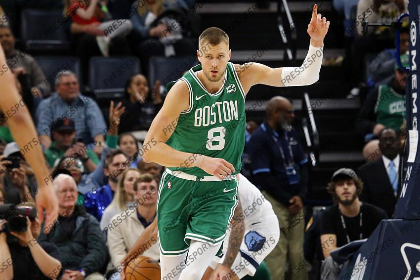 Nov 19, 2023; Memphis, Tennessee, USA; Boston Celtics center Kristaps Porzingis (8) reacts after a dunk during the second half against the Memphis Grizzlies at FedExForum. Mandatory Credit: Petre Thomas-USA TODAY Sports NBA: Boston Celtics at Memphis Grizzlies 