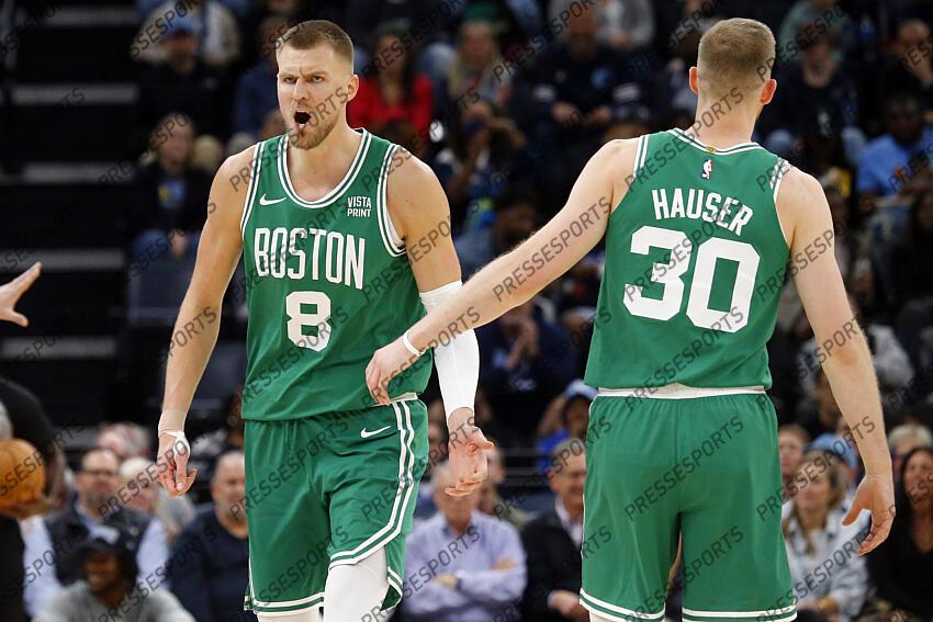 Nov 19, 2023; Memphis, Tennessee, USA; Boston Celtics center Kristaps Porzingis (8) reacts with Boston Celtics forward Sam Hauser (30) during the second half against the Memphis Grizzlies at FedExForum. Mandatory Credit: Petre Thomas-USA TODAY Sports NBA: Boston Celtics at Memphis Grizzlies 