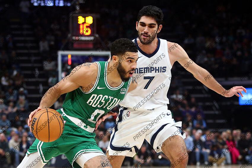 Nov 19, 2023; Memphis, Tennessee, USA; Boston Celtics forward Jayson Tatum (0) drives to the basket as Memphis Grizzlies forward-center Santi Aldama (7) defends during the first half at FedExForum. Mandatory Credit: Petre Thomas-USA TODAY Sports NBA: Boston Celtics at Memphis Grizzlies 