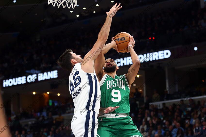Nov 19, 2023; Memphis, Tennessee, USA; Boston Celtics guard Derrick White (9) shoots as Memphis Grizzlies guard John Konchar (46) defends during the first half at FedExForum. Mandatory Credit: Petre Thomas-USA TODAY Sports NBA: Boston Celtics at Memphis Grizzlies 