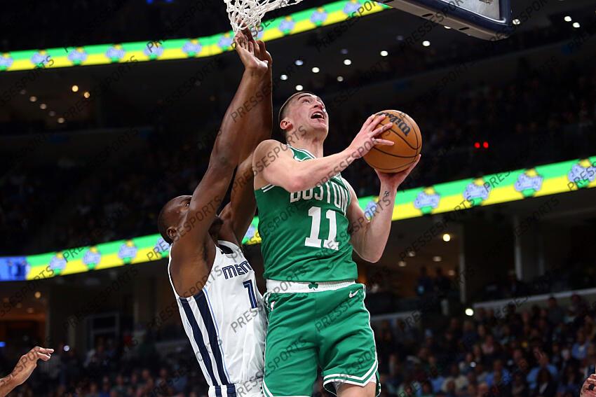 Nov 19, 2023; Memphis, Tennessee, USA; Boston Celtics guard Payton Pritchard (11) shoots as Memphis Grizzlies center Bismack Biyombo (18) defends during the first half at FedExForum. Mandatory Credit: Petre Thomas-USA TODAY Sports NBA: Boston Celtics at Memphis Grizzlies 