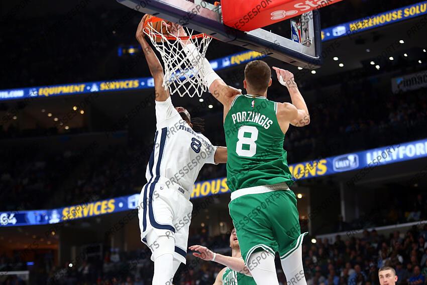 Nov 19, 2023; Memphis, Tennessee, USA; Boston Celtics center Kristaps Porzingis (8) blocks the shot of Memphis Grizzlies forward Ziaire Williams (8) during the second half at FedExForum. Mandatory Credit: Petre Thomas-USA TODAY Sports NBA: Boston Celtics at Memphis Grizzlies 
