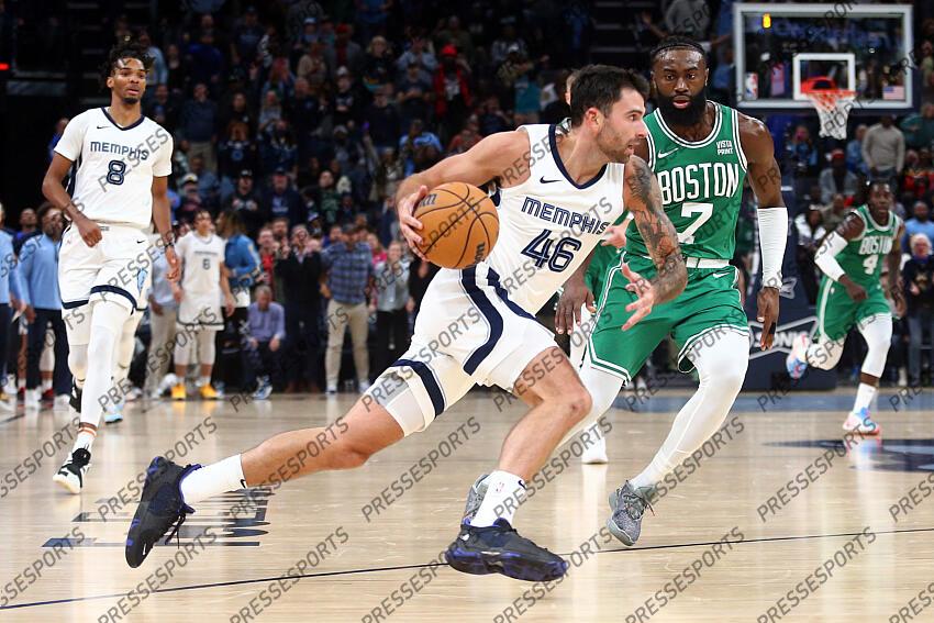 Nov 19, 2023; Memphis, Tennessee, USA; Memphis Grizzlies guard John Konchar (46) dribbles as Boston Celtics guard Jaylen Brown (7) defends during the second half at FedExForum. Mandatory Credit: Petre Thomas-USA TODAY Sports NBA: Boston Celtics at Memphis Grizzlies 