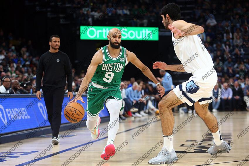 Nov 19, 2023; Memphis, Tennessee, USA; Boston Celtics guard Derrick White (9) dribbles against Memphis Grizzlies forward-center Santi Aldama (7) during the first half at FedExForum. Mandatory Credit: Petre Thomas-USA TODAY Sports NBA: Boston Celtics at Memphis Grizzlies 
