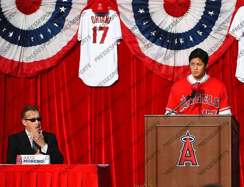 Dec 9, 2017; Anaheim, CA, USA; Los Angeles Angels owner Arte Moreno listens as Shohei Ohtani (17) is introduced to media and fans during a press conference today at Anaheim Stadium of Anaheim. Mandatory Credit: Jayne Kamin-Oncea-USA TODAY Sports MLB: Los Angeles Angels-Press Conference 